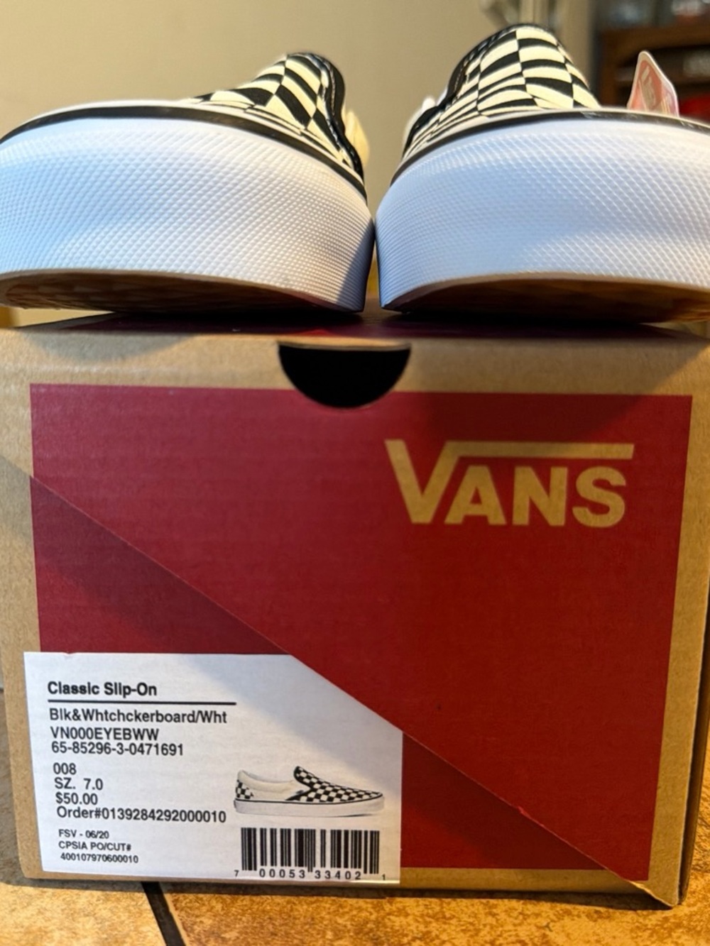 Vans Checkerboard Slip-On in Black and White